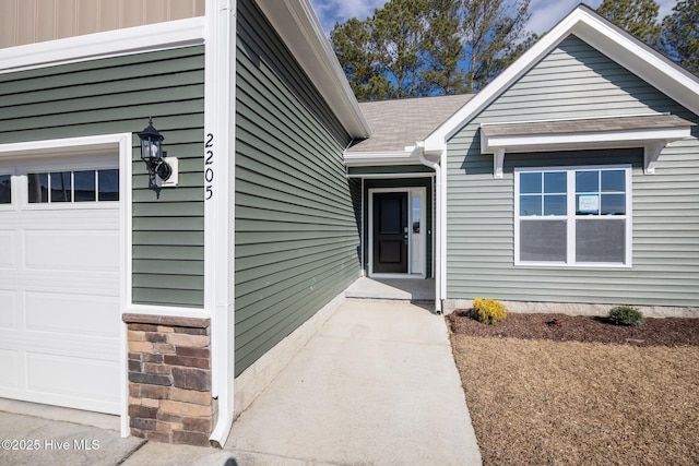 property entrance with a garage