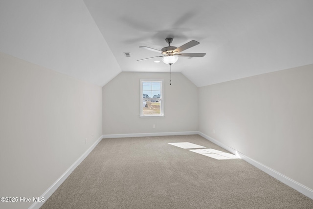 bonus room featuring ceiling fan, vaulted ceiling, and light colored carpet