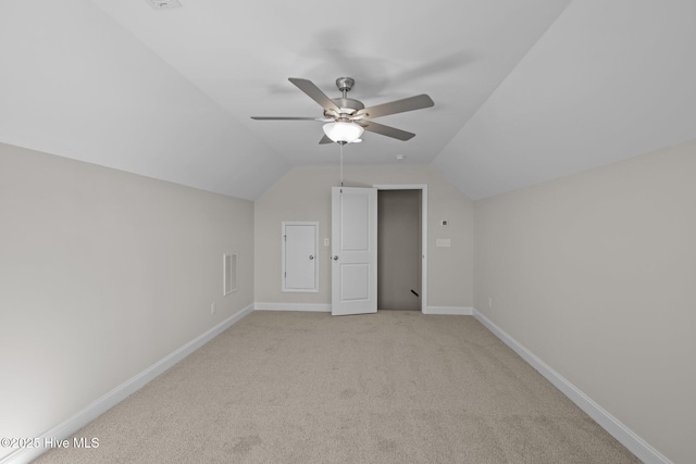 bonus room featuring light carpet, lofted ceiling, and ceiling fan