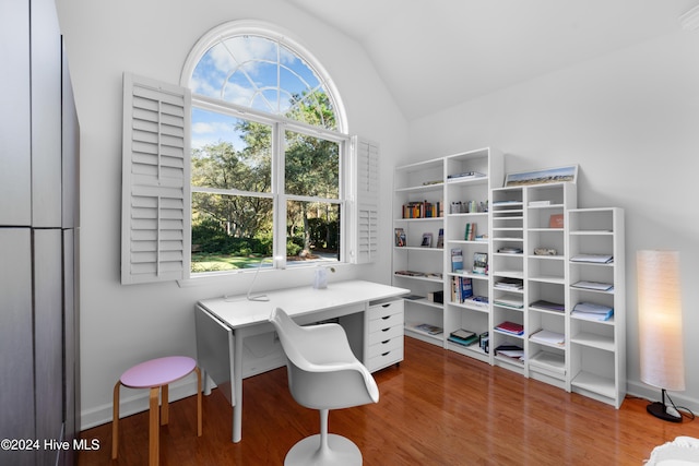 office space featuring hardwood / wood-style floors and lofted ceiling