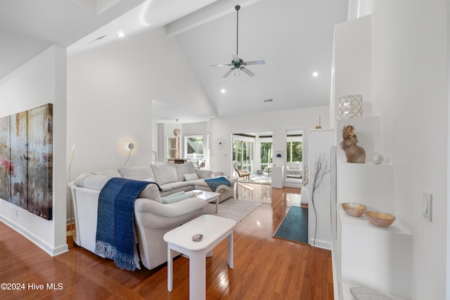 living room with beam ceiling, ceiling fan, high vaulted ceiling, and hardwood / wood-style flooring