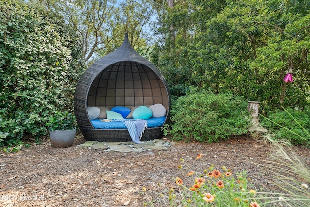 bedroom with access to outside and light carpet