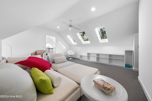 carpeted bedroom featuring ceiling fan and vaulted ceiling with skylight