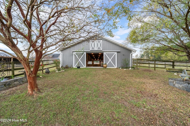 view of outdoor structure with a yard