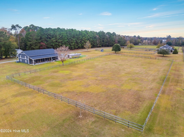 birds eye view of property featuring a rural view