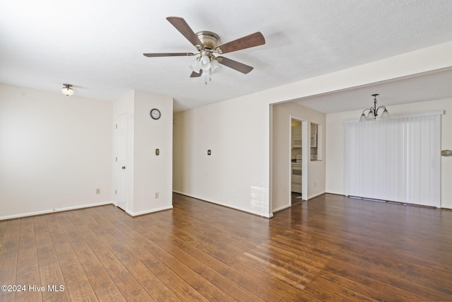 unfurnished room with ceiling fan with notable chandelier, dark hardwood / wood-style flooring, and a textured ceiling