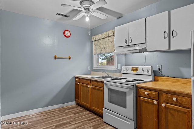 kitchen featuring light wood-type flooring, white electric range oven, ceiling fan, sink, and white cabinetry