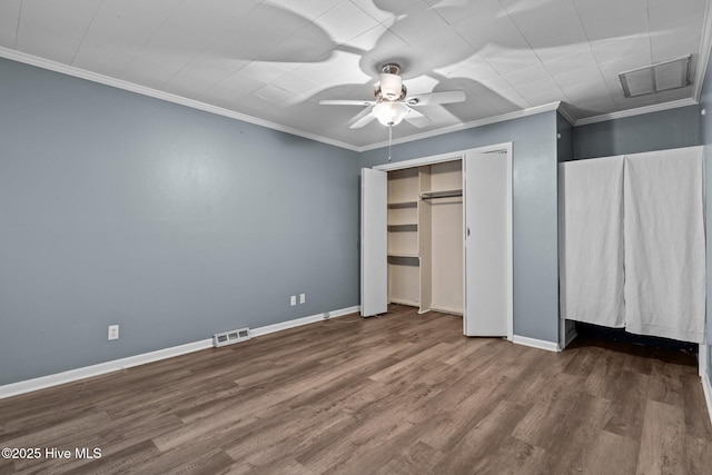 unfurnished bedroom featuring a closet, ceiling fan, hardwood / wood-style floors, and ornamental molding