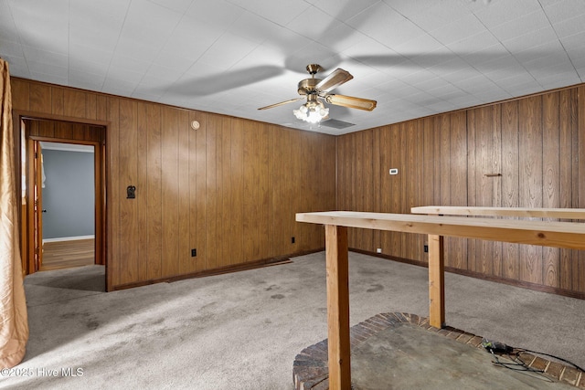 interior space featuring ceiling fan and light colored carpet