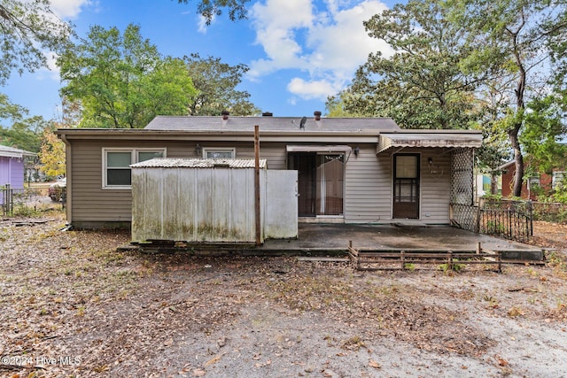 back of property featuring a patio