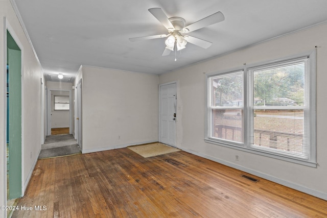 spare room featuring hardwood / wood-style floors and ceiling fan