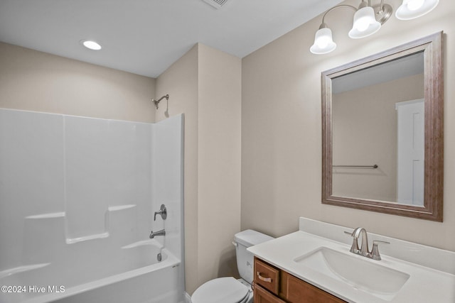 full bathroom featuring tub / shower combination, toilet, and vanity