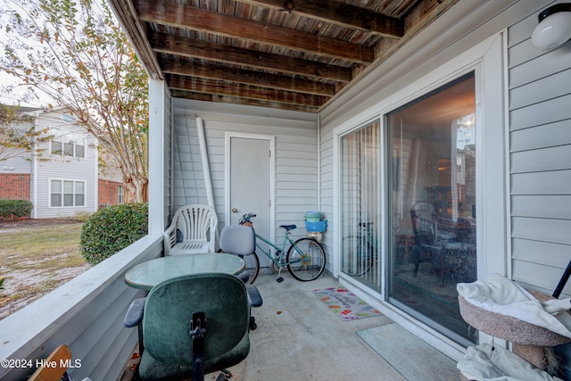 view of patio featuring a balcony