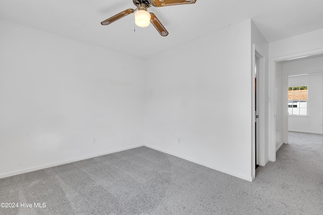 carpeted empty room with ceiling fan