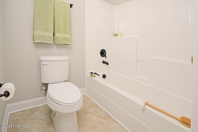 bathroom with washtub / shower combination and toilet