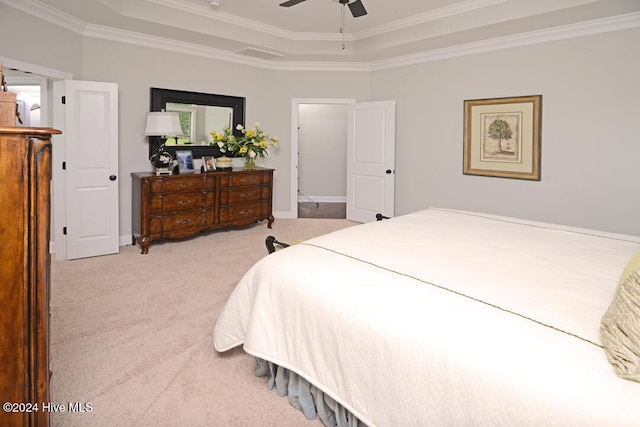 bedroom featuring ceiling fan, light carpet, ornamental molding, and a raised ceiling