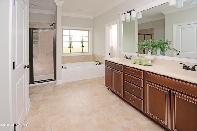 bathroom featuring vanity, ornamental molding, and separate shower and tub