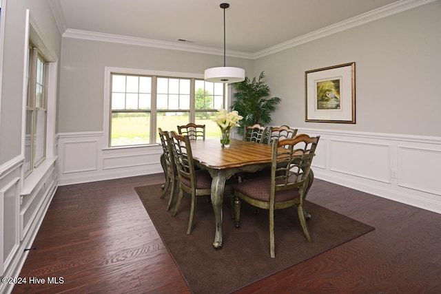 dining room featuring dark hardwood / wood-style floors and ornamental molding