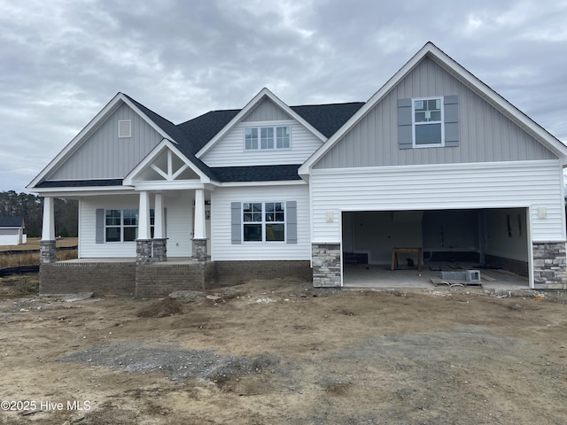 craftsman-style home with covered porch and a garage