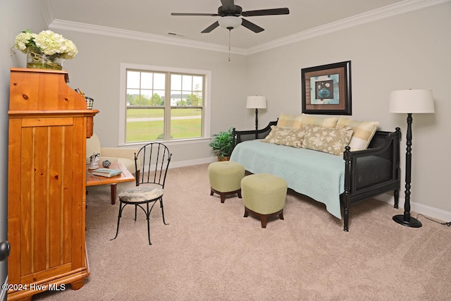 carpeted bedroom featuring ceiling fan and ornamental molding