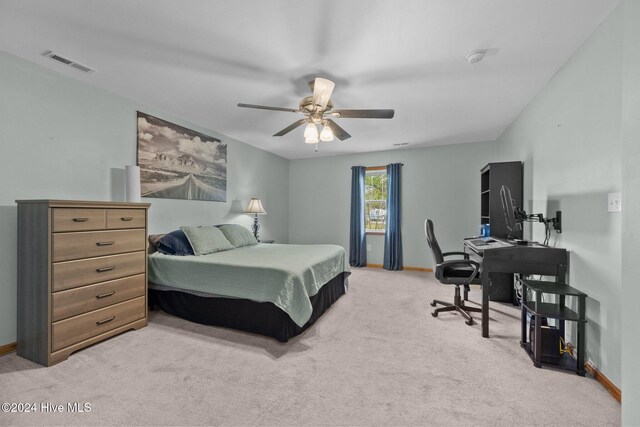 bedroom featuring light carpet and ceiling fan