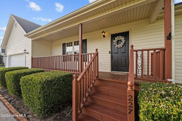 property entrance with covered porch