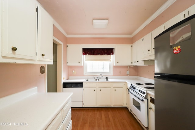 kitchen with ornamental molding, white appliances, sink, light hardwood / wood-style flooring, and white cabinets