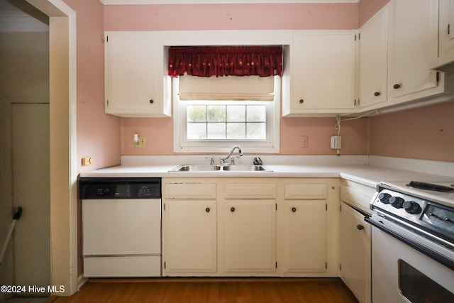 kitchen with white cabinetry, wood-type flooring, white appliances, and sink