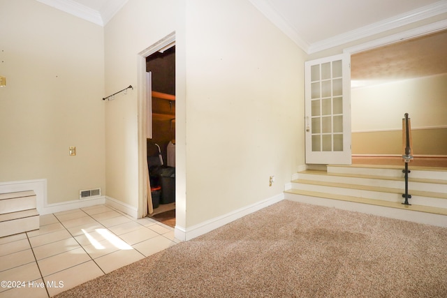 spare room with light colored carpet and crown molding