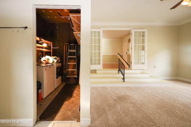 interior space with washer and clothes dryer, carpet floors, and ornamental molding