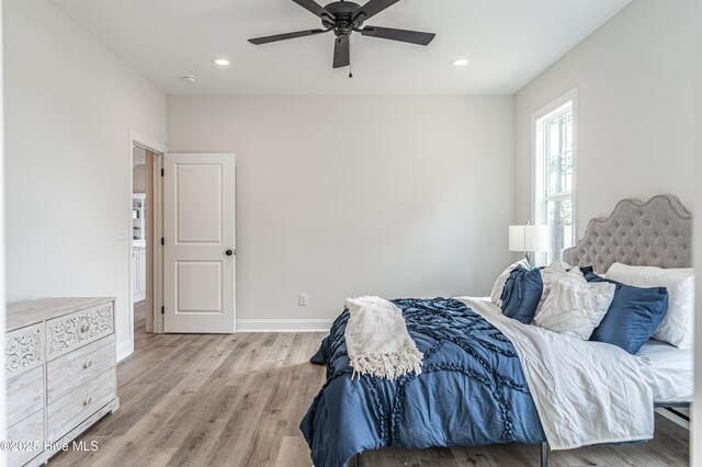 walk in closet featuring wood finished floors