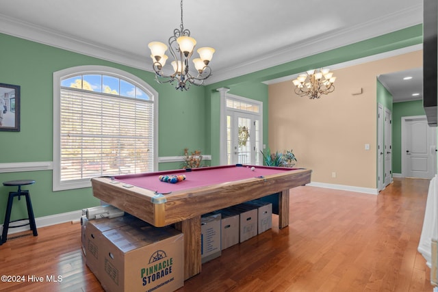 game room with ornamental molding, light hardwood / wood-style flooring, pool table, and a chandelier