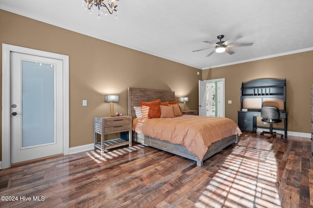 bedroom with crown molding, dark hardwood / wood-style flooring, and ceiling fan with notable chandelier