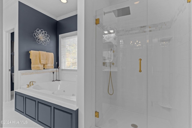 bathroom featuring independent shower and bath and ornamental molding