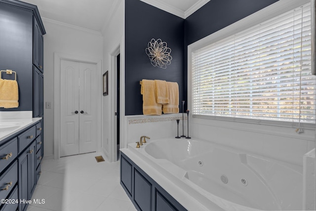 bathroom with a bathing tub, vanity, crown molding, and tile patterned floors