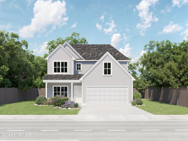 view of front of home with a front yard and a garage