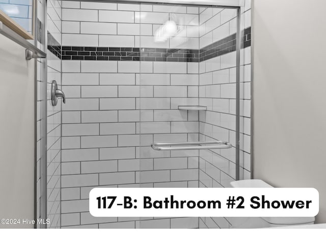 full bathroom featuring a stall shower