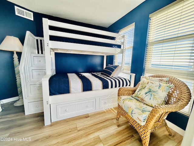 bedroom featuring wood-type flooring