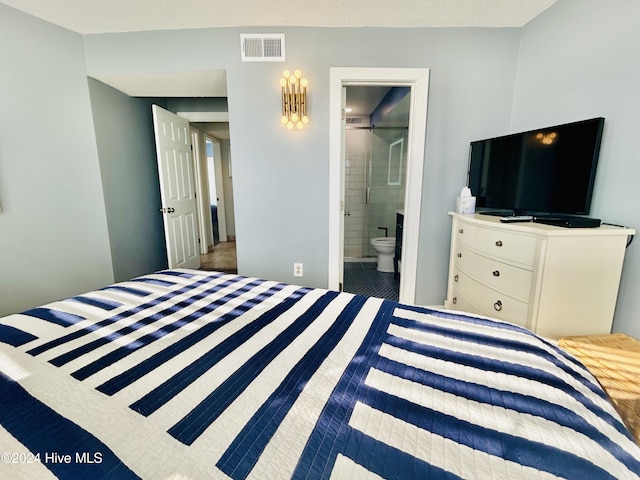 bedroom featuring ensuite bath