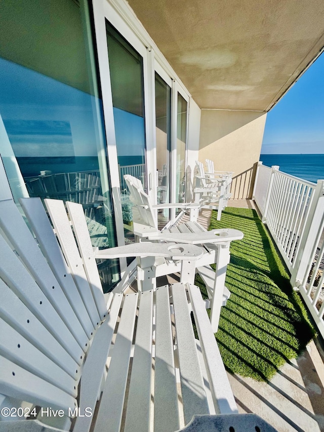 balcony featuring a water view