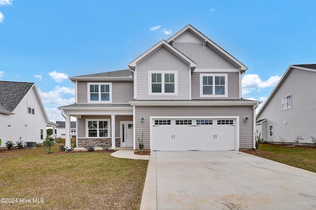 craftsman-style house with central AC unit, a garage, and a front yard