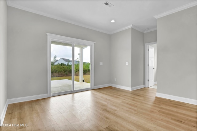 unfurnished room with crown molding and light hardwood / wood-style flooring