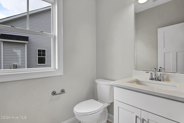2765 Longleaf Pine Cir, Leland, NC 28451 - bathroom with baseboards and vanity