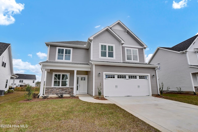 craftsman-style house featuring central AC unit, a front yard, and a garage