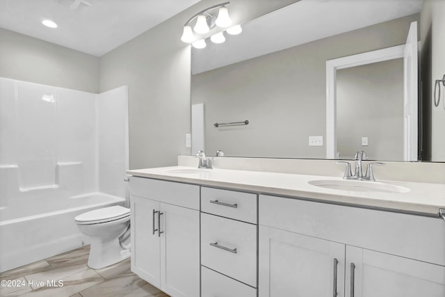 full bathroom featuring shower / bathing tub combination, vanity, and toilet