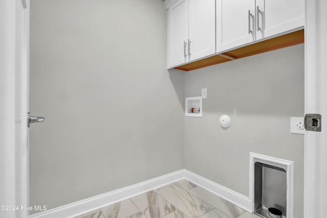 laundry area with cabinets and washer hookup