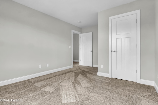 unfurnished bedroom featuring carpet flooring