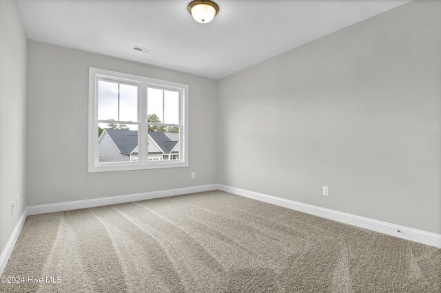 2765 Longleaf Pine Cir, Leland, NC 28451 - unfurnished bedroom featuring carpet floors and baseboards