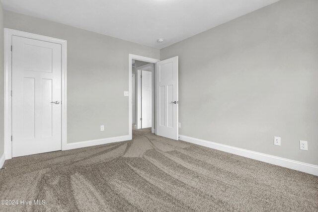 2765 Longleaf Pine Cir, Leland, NC 28451 - carpeted spare room featuring baseboards