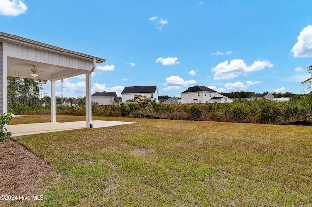 view of yard featuring ceiling fan